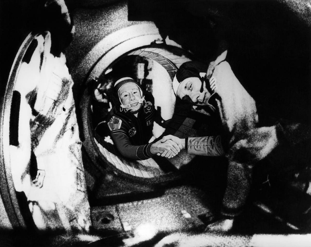 (FILES) In this file photo taken on July 17, 1975, Commander of the Soviet crew of Soyuz, Alexei Leonov (L) and commander of the US crew of Apollo, Thomas Stafford (R), shake hands after the Apollo-Soyuz docking maneuvers. AFP/HO/NASA