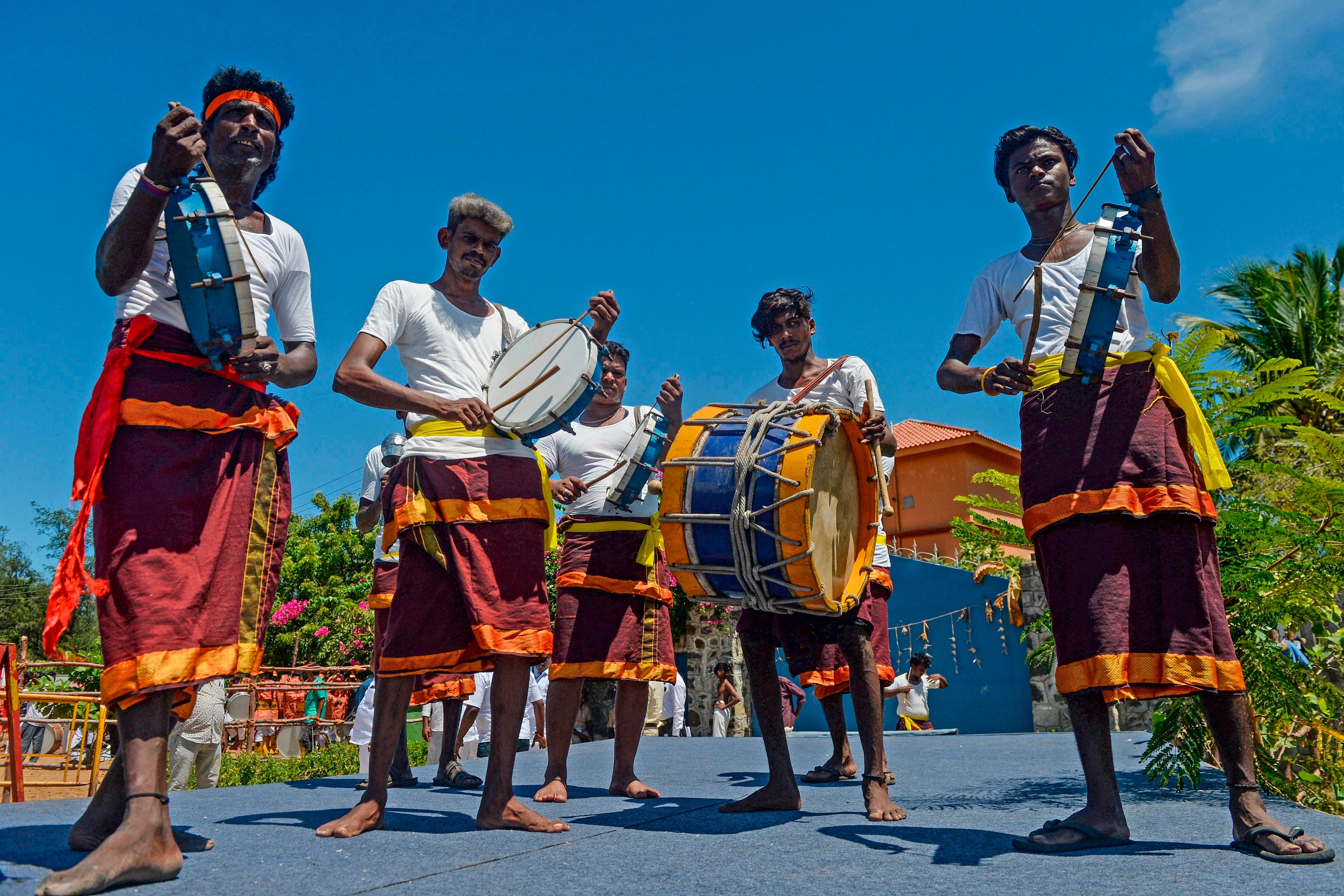 Chenda Melam (Kerala's percussion instruments) artists prepare to welcome China's President Xi Jinping in Chennai on October 11, 2019, ahead of a summit with India's Prime Minister Narendra Modi (L) to be held at world heritage site of Mahabalipuram from October 11 to 12 in Tamil Nadu state. (AFP Photo)