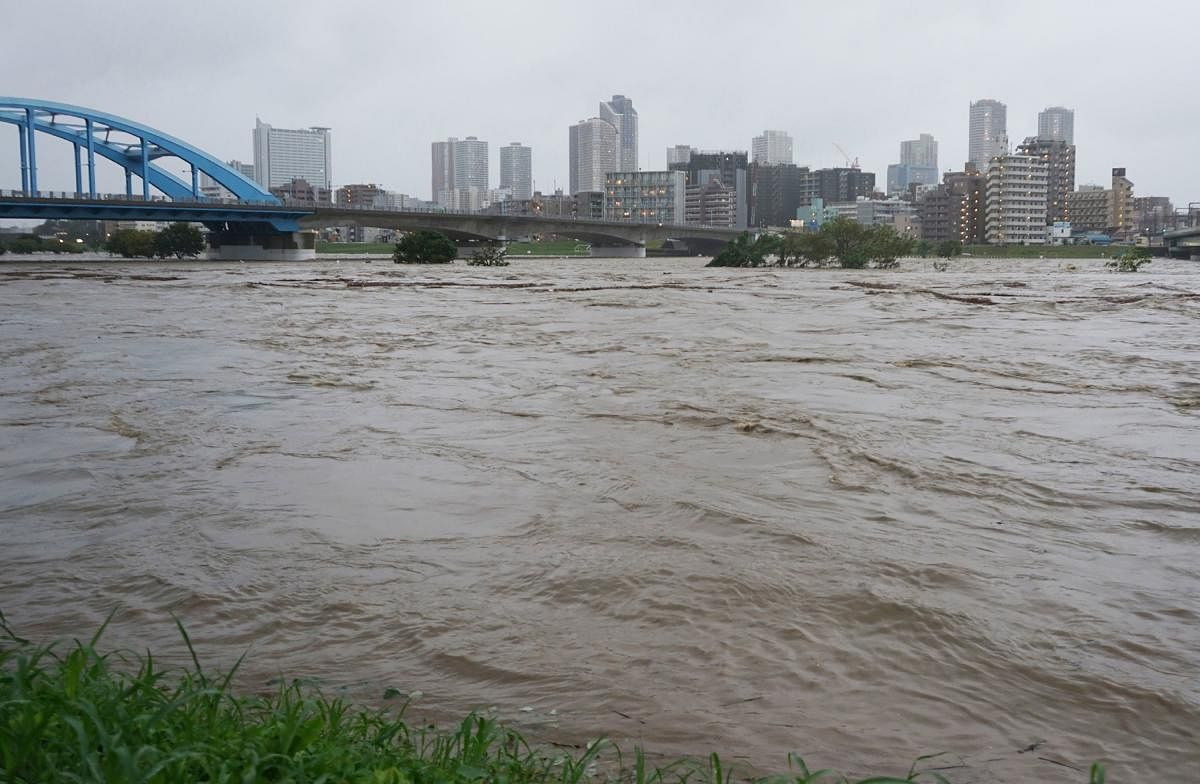 Swollen water levels along Tama river are pictured after heavy rains brought by approaching Typhoon Hagibis hit the Tokyo area on October 12, 2019. AFP Photo