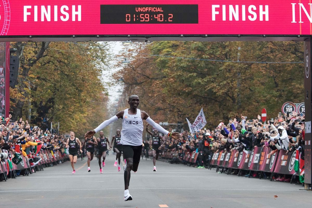 Kenya's Eliud Kipchoge on Saturday made history, busting the mythical two-hour barrier for the marathon on a specially prepared course in a huge Vienna park. AFP Photo