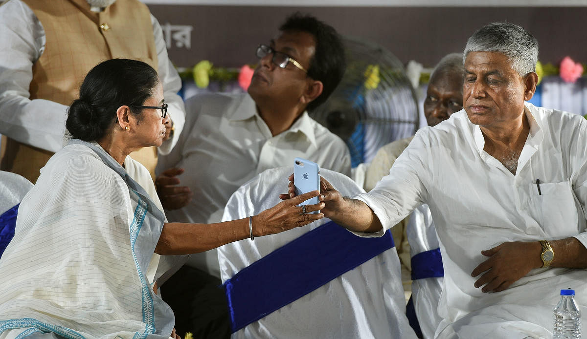 West Bengal Chief Minister Mamata Banerjee and Congress MLA Abdul Mannan. (PTI Photo)