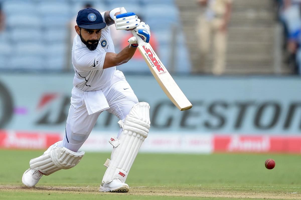 Indian captain Virat Kohli drives one to the fence en route his brilliant unbeaten 254 against South Africa on the second day of the second Test in Pune on Friday. AFP 