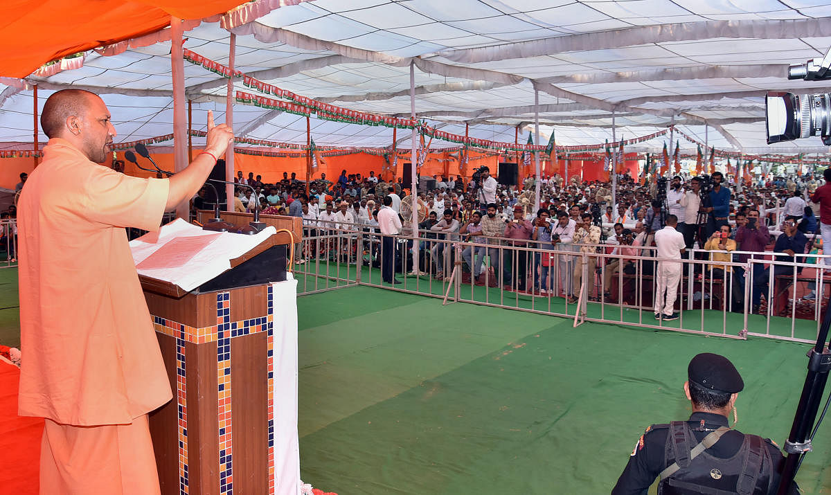 Uttar Pradesh Chief Minister Yogi Adityanath addresses during a campaign ahead of Haryana Assembly polls, in Sonipat. (PTI Photo)