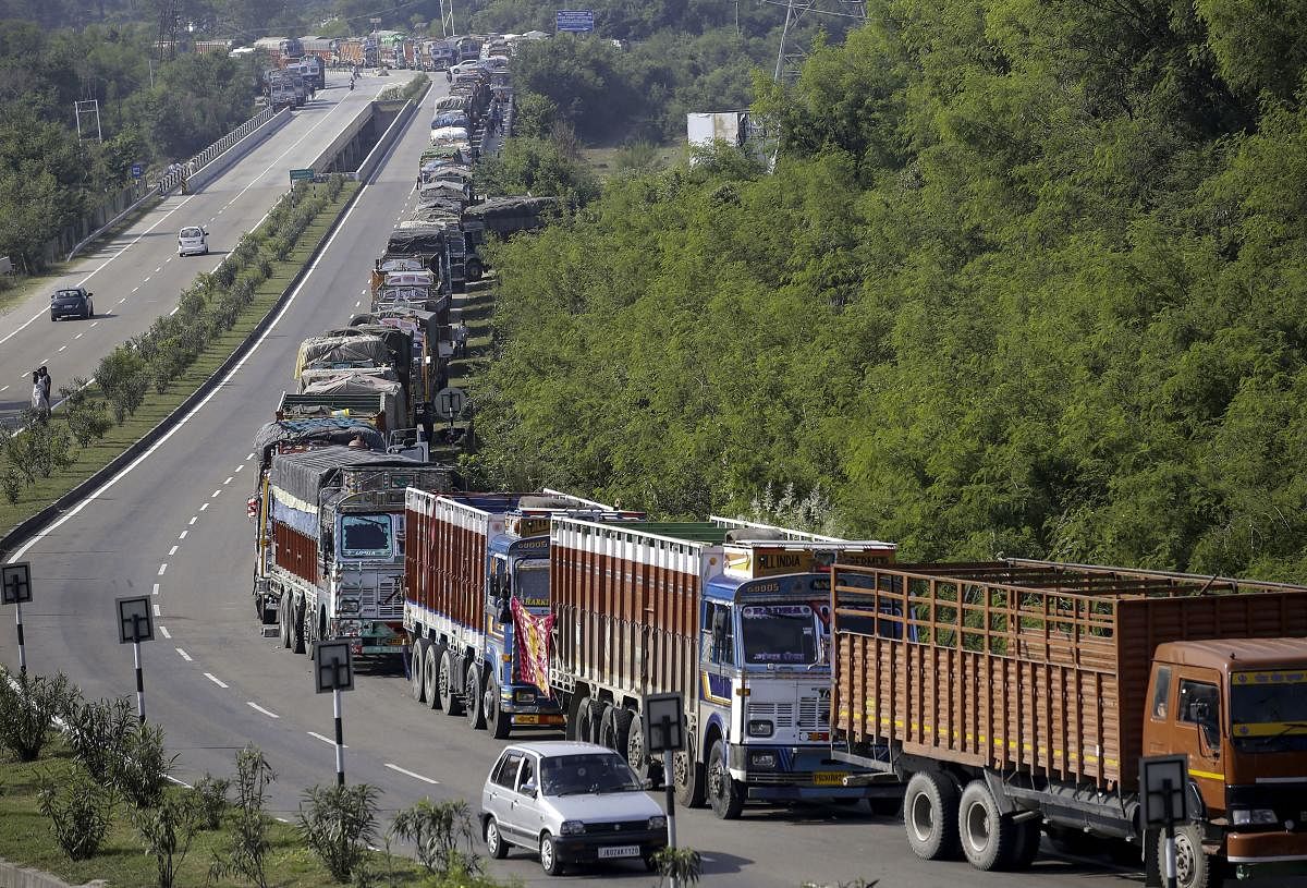  Stranded trucks along the Jammu-Srinagar National Highway which remained closed due to landslides, in Ramban area of Jammu, Sunday, Oct. 13, 2019. (PTI Photo)