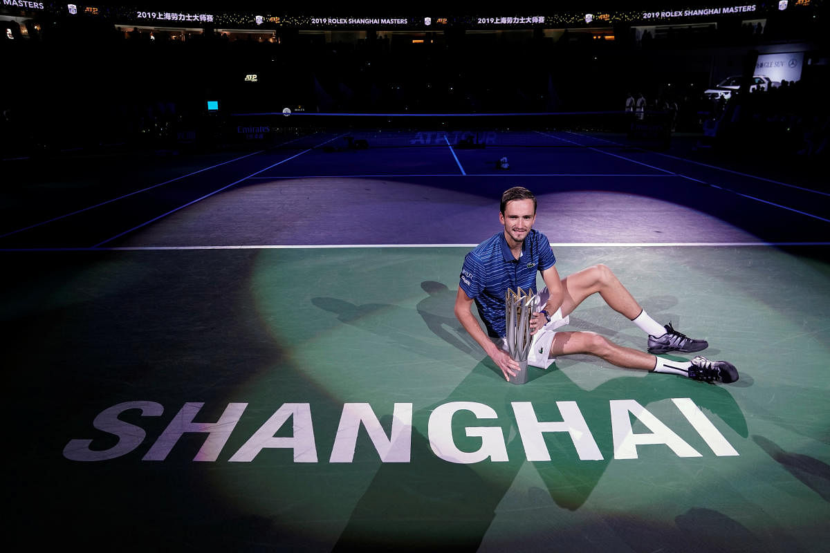 Daniil Medvedev of Russia celebrates winning Shanghai Masters with his trophy. REUTERS/Aly Song