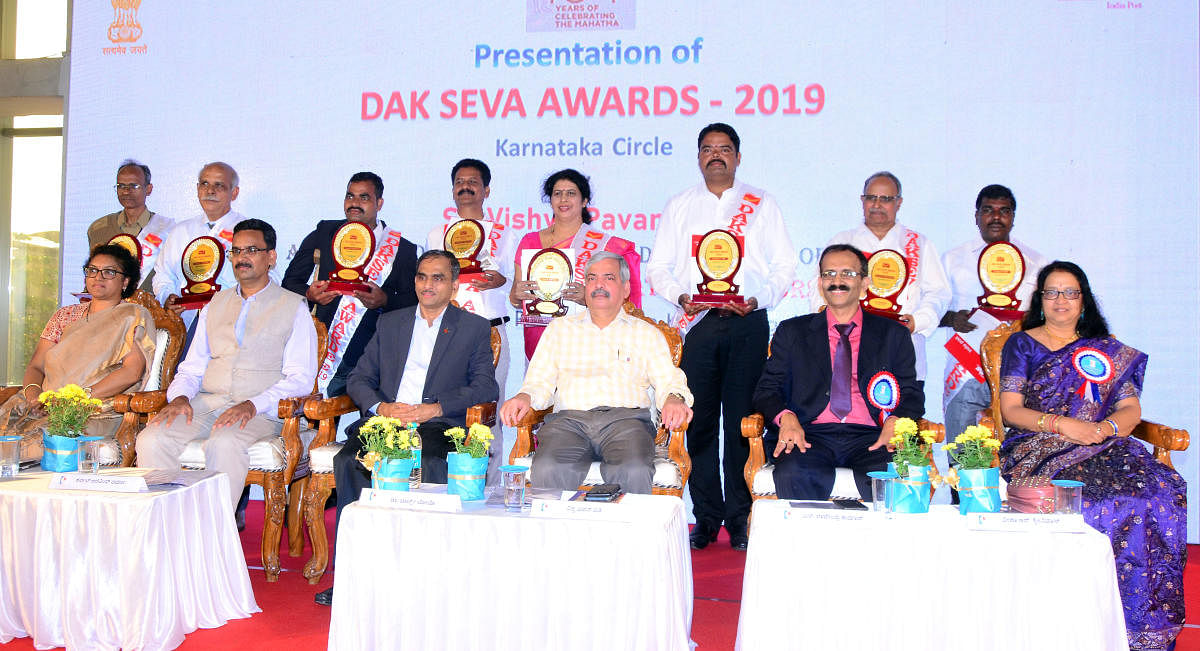Dak Seva awardees with the dignitaries at ‘Karnapex 2019’ held at TMA Pai Convention Hall in Mangaluru.  DH photo