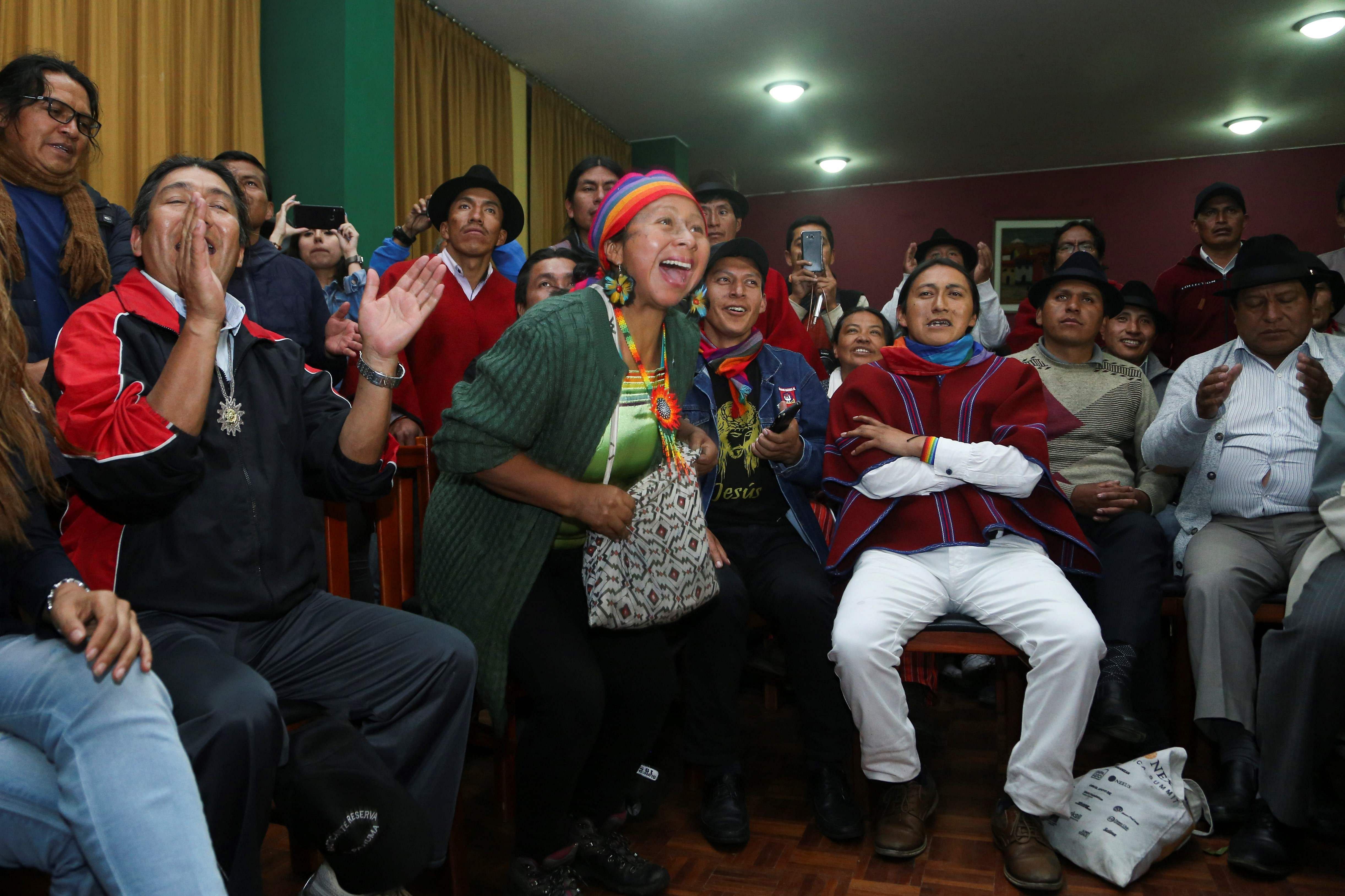 Indigenous people celebrate after a meeting with the Ecuadorean president in Quito. (AFP Photo)