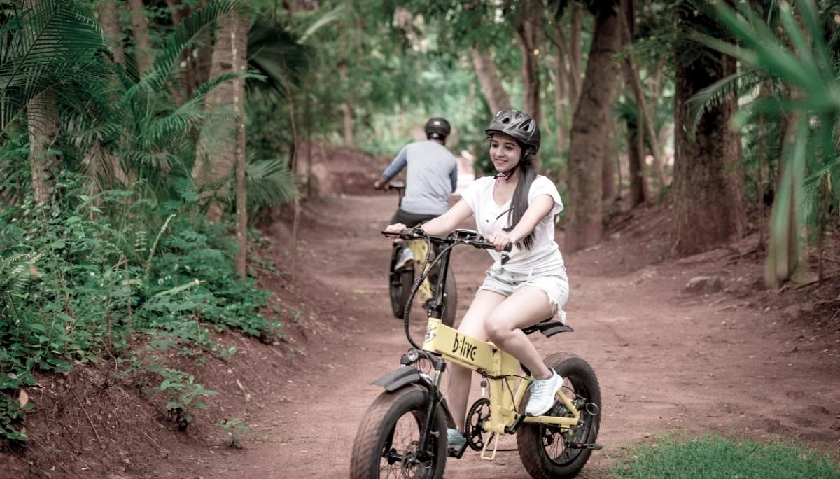 A tourist on an e-bike, in Mysuru.