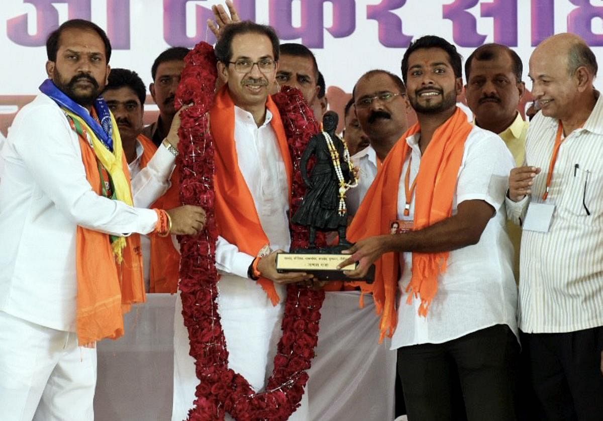 Shiv Sena chief Uddhav Thackeray being presented a memento during an election campaign rally in support of the BJP-Sena candidate Rahul Patil ahead of the Maharashtra Assembly polls, in Parbhani, on Sunday. PTI