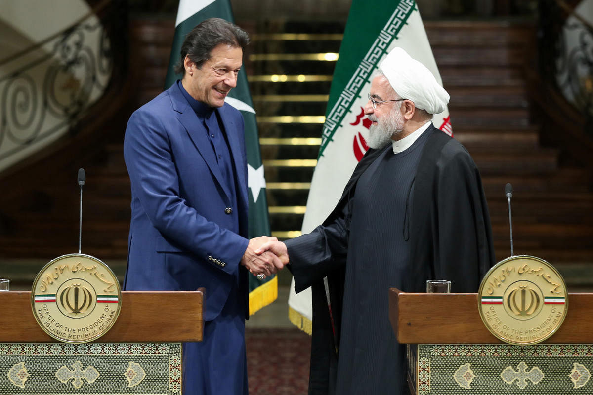 Pakistan Prime Minister Imran Khan  with Iranian President Hassan Rouhani(Reuters Photo)