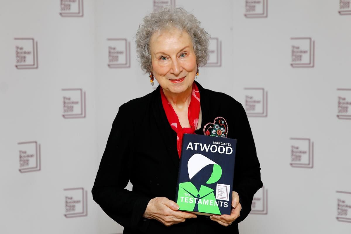 Canadian author Margaret Atwood poses with her book 'The Testaments' during the photo call for the authors shortlisted for the 2019 Booker Prize for Fiction at Southbank Centre in London on October 13, 2019. (AFP)