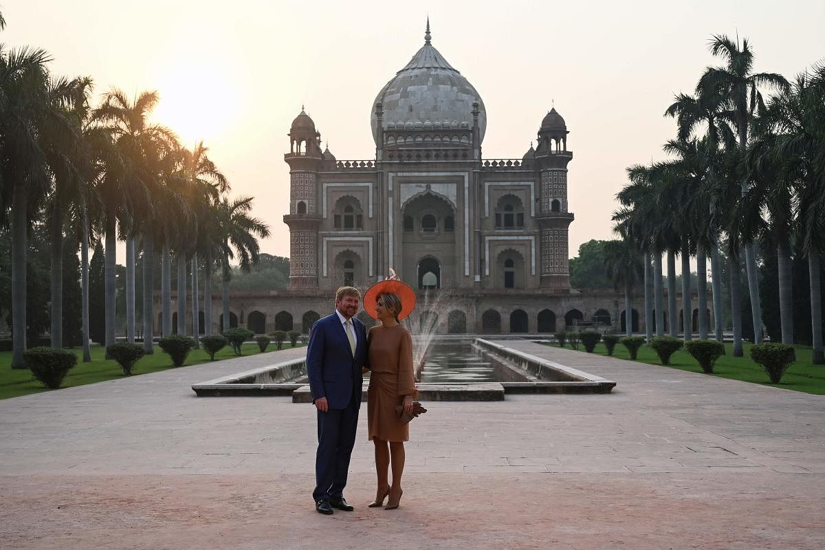 Dutch King Willem-Alexander (L) and Queen Maxima (R) pose for photos as they visit the Mughal-era Safdarjung's Tomb in New Delhi on October 15, 2019. (Photo by Money SHARMA / AFP)