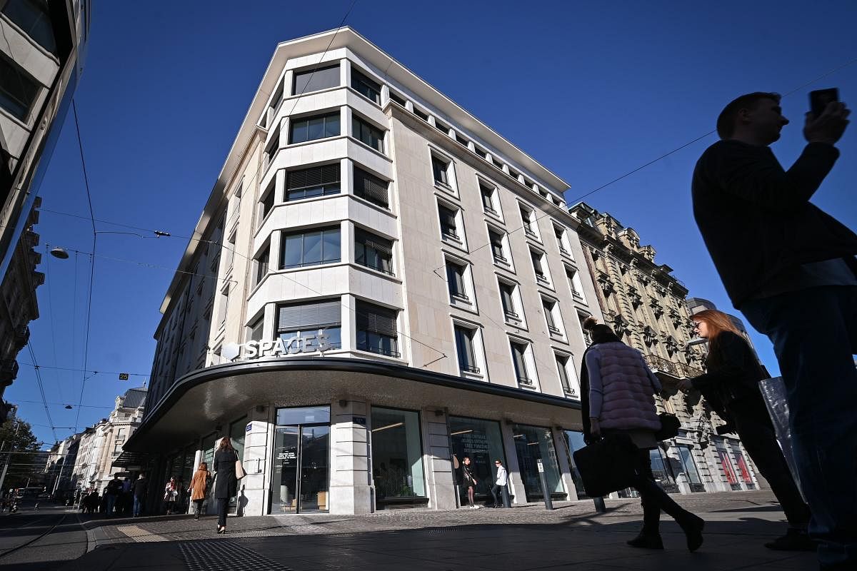 A photograph taken on October 11, 2019, shows pedestrians passing by the building hosting Facebook's Libra Networks LLC company downtown Geneva, as Paypal announced they will withdraw from the Libra network. (AFP)