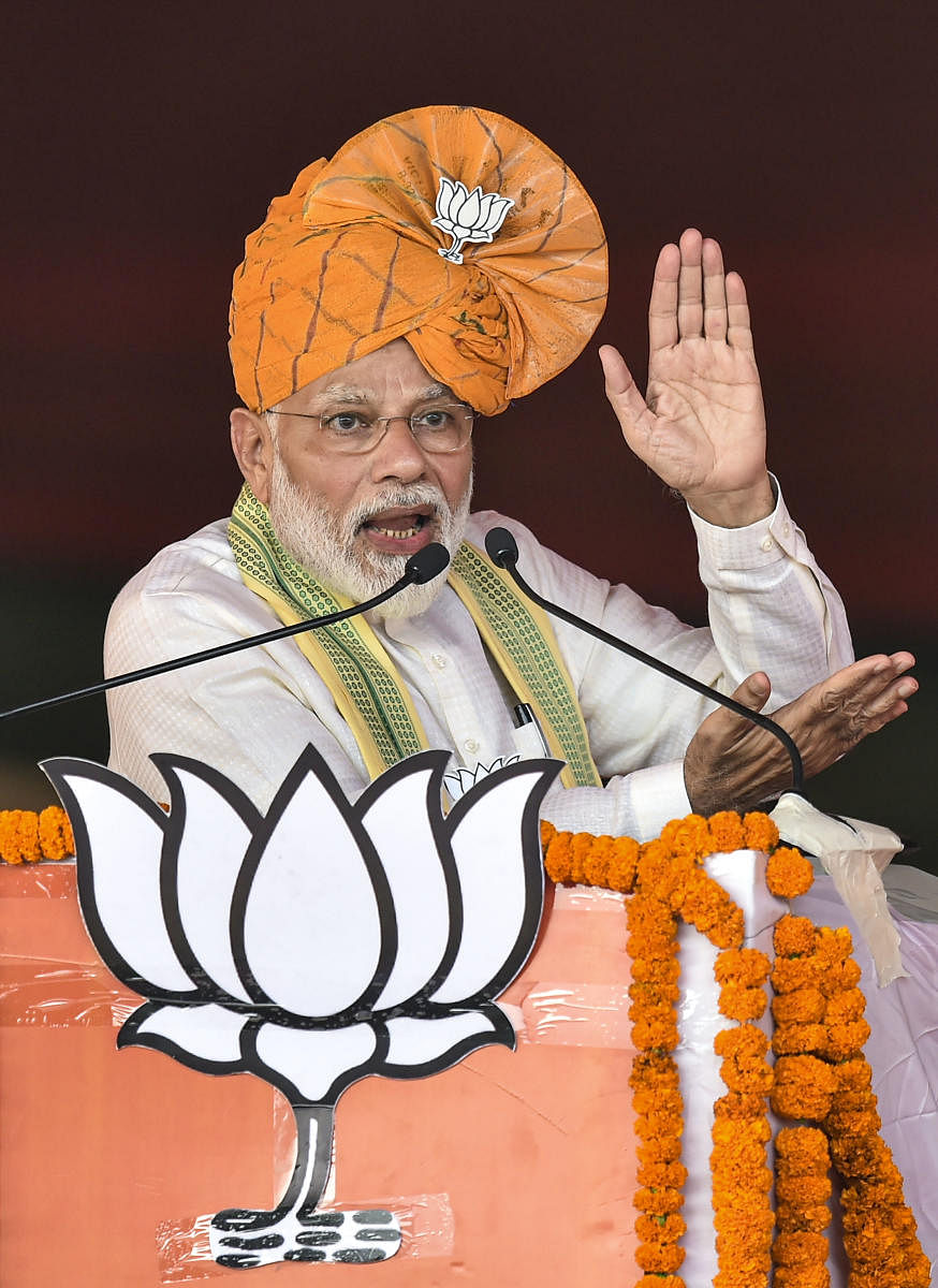 Prime Minister Narendra Modi addresses an election campaign rally for upcoming Haryana Assembly polls, at Ballabgarh in Faridabad district, Monday, Oct. 14, 2019. (PTI Photo)