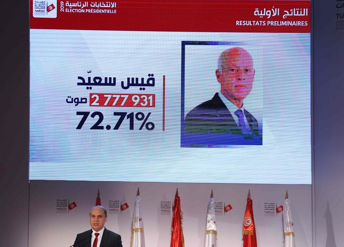 ISIE President Nabil Baffoune gives a press conference to announce the results of Tunisia's Presidential elections on October 14, 2019 in Tunis. (AFP)