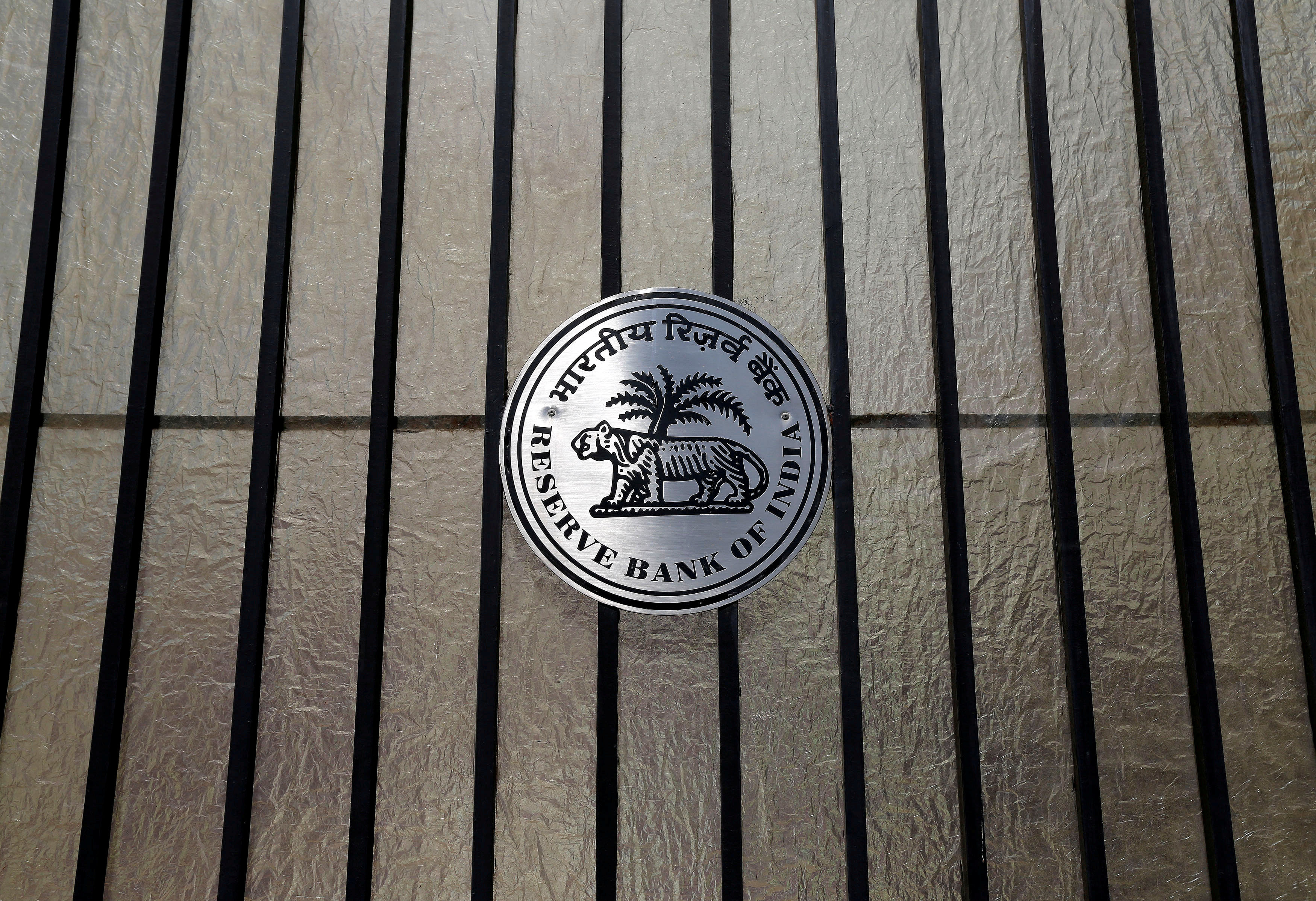 A Reserve Bank of India (RBI) logo is seen at the entrance gate of its headquarters in Mumbai. (Reuters Photo)