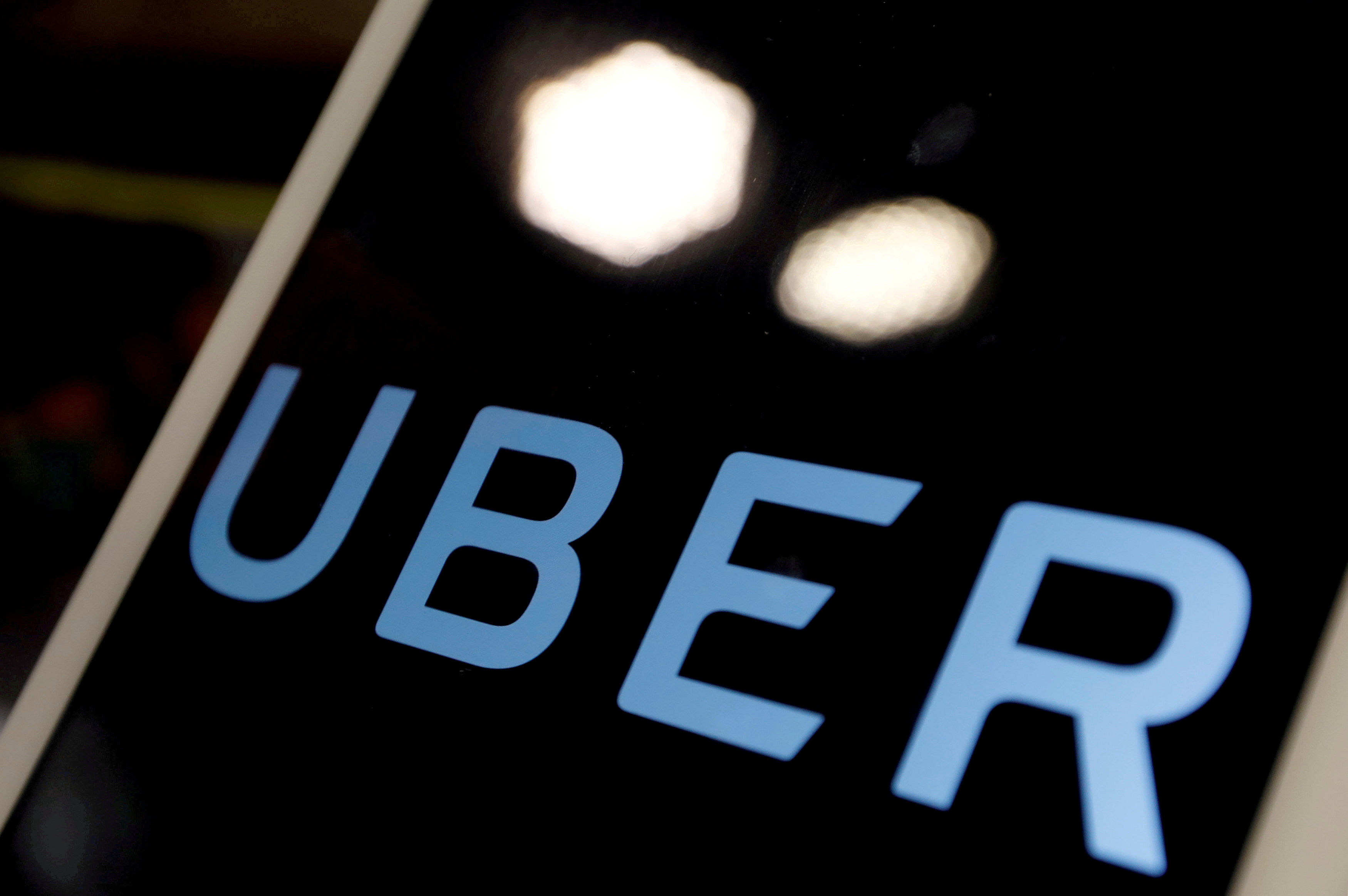 The logo of Uber is seen on an iPad, during a news conference to announce Uber resumes ride-hailing service, in Taipei, Taiwan. (Reuters Photo)