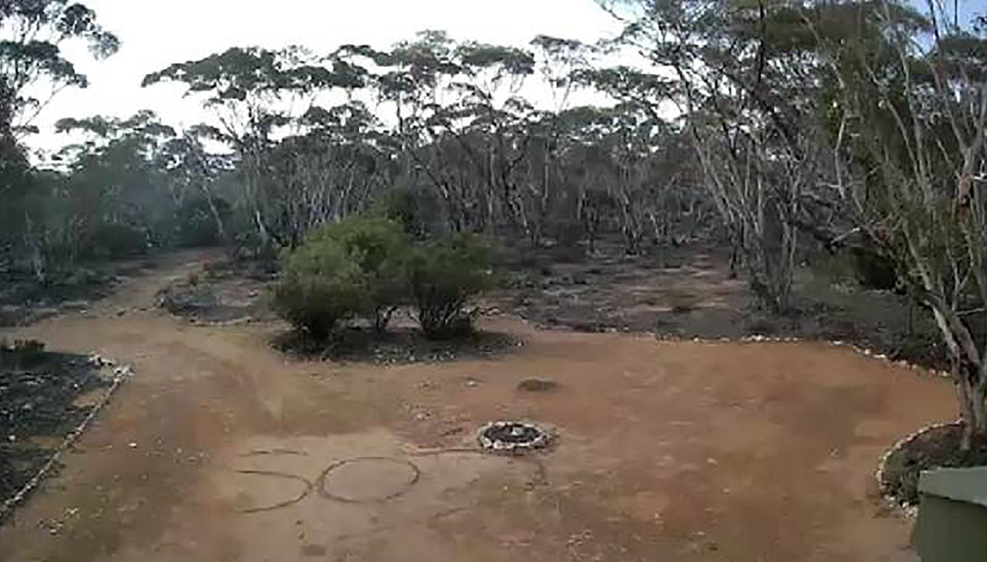 An SOS sign written in the dirt by Australian woman Deborah Pilgrim after going missing on October 13 while camping with friends about 100 kilometres from Adelaide. (AFP Photo)