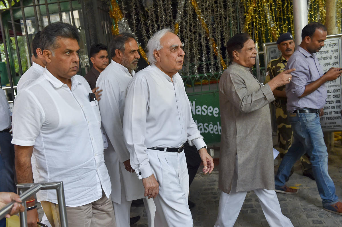 A delegation of senior Congress party leaders Manish Tewari, Kapil Sibal, Anand Sharma, Ahmed Patel leave after a meeting with the Election Commission of India. (PTI Photo)