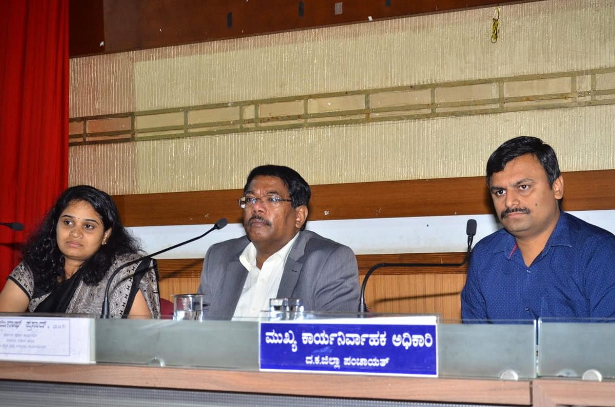 District In-charge Secretary N Manjunath Prasad, flanked by Deputy Commissioner Sindhu B Rupesh (left) and Zilla Panchayat CEO Dr R Selvamani, chairs a review meeting at the Zilla Panchayat hall in Mangaluru on Wednesday.
