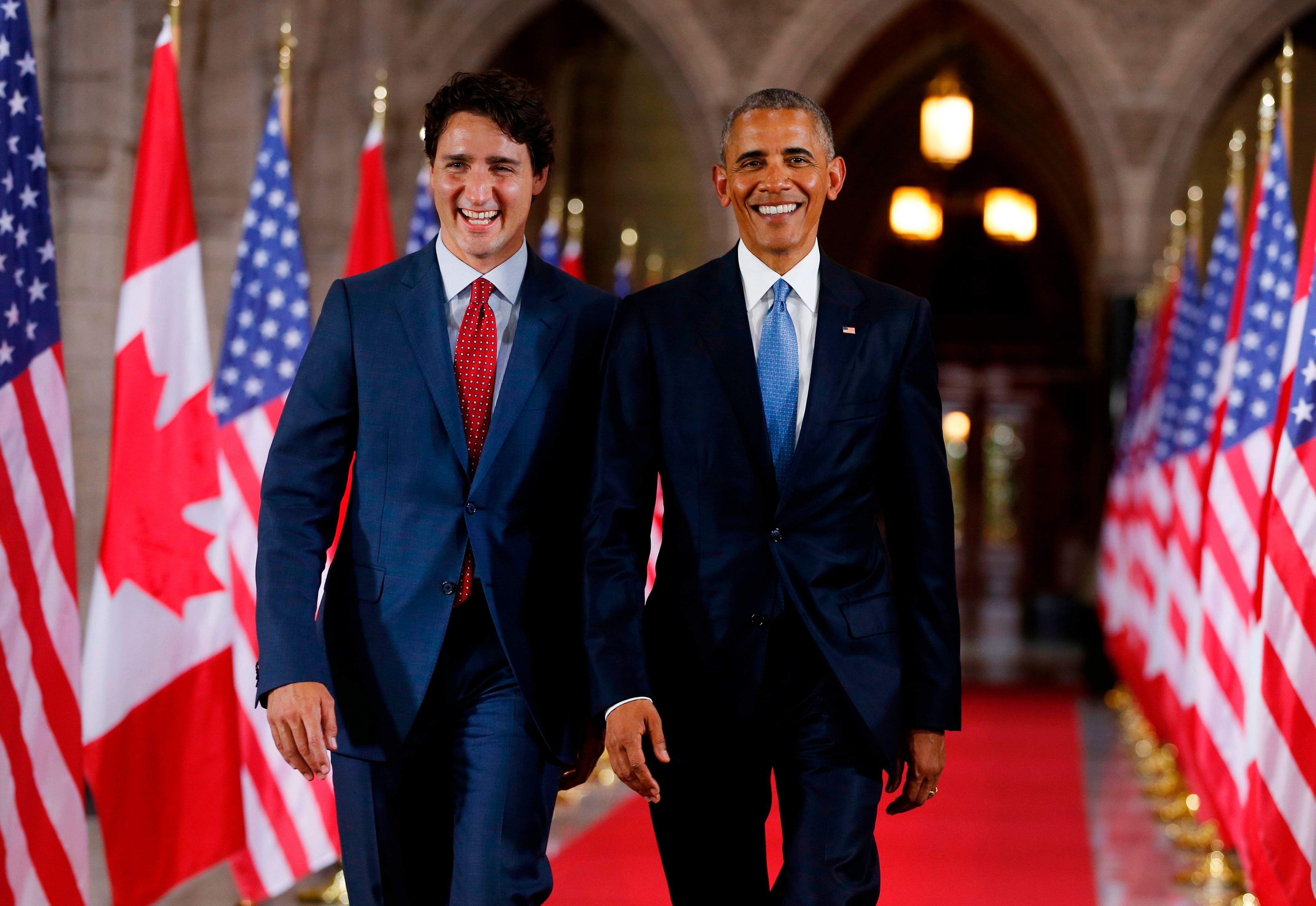 Prime Minister of Canada Justin Trudeau (L) and US President Barack Obama exit the Hall of Honour on Parliament Hill following the North American Leaders Summit in Ottawa. (AFP Photo)