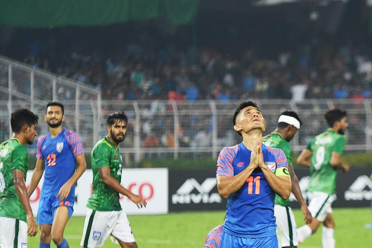 Sunil Chhetri (R) reacts after missing a goal during the World Cup 2022 and 2023 AFC Asian Cup qualifying football match between India and Bangladesh at the Vivekananda Yuba Bharati Krirangan in Kolkata on October 15, 2019. (AFP)