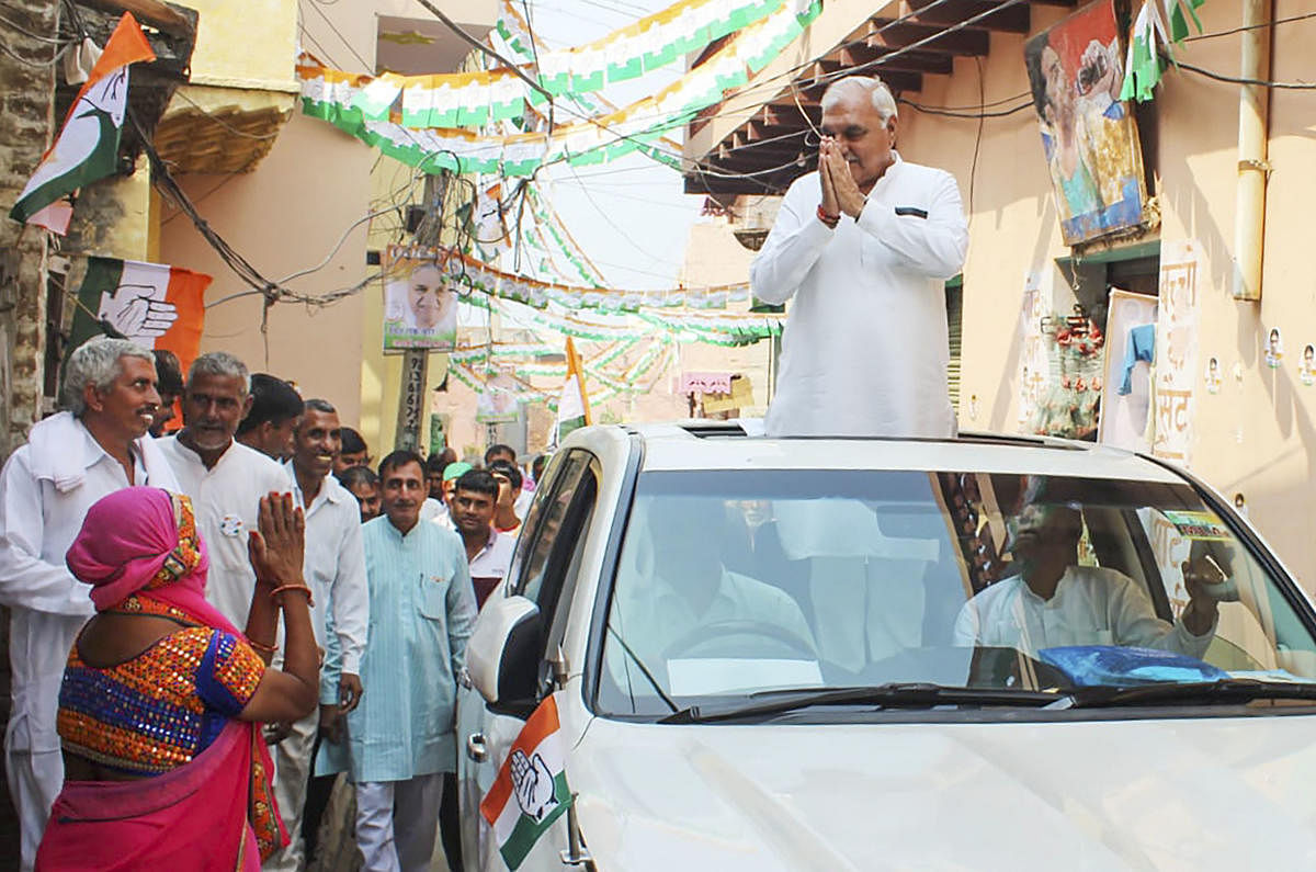 Former Chief Minister of Haryana Bhupinder Singh Hooda during his election campaign in Garhi Sampla-Kiloi constituency in Rohtak district on Wednesday. (PTI Photo)