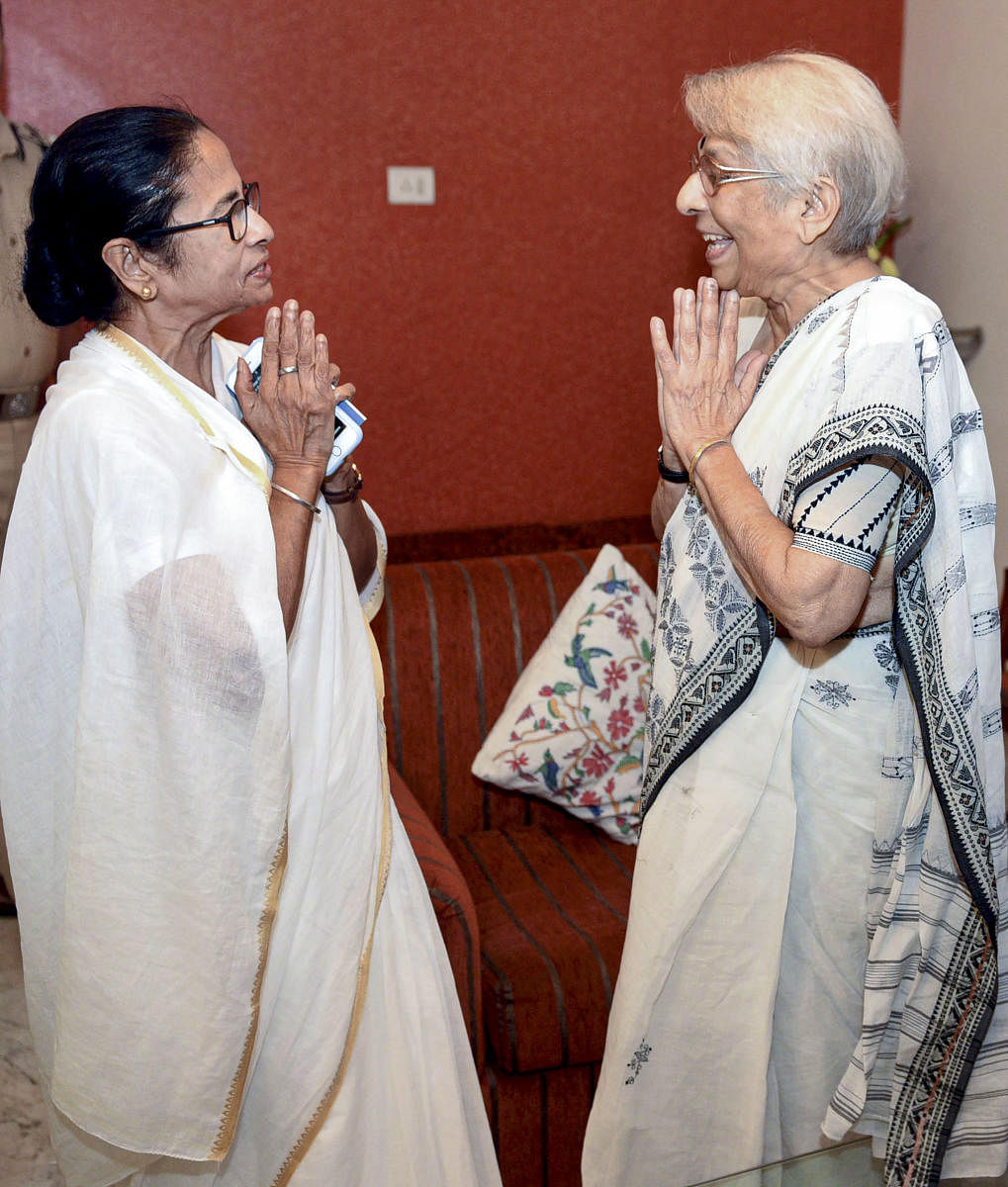 West Bengal Chief Minister Mamata Banerjee exchanges greetings with Nirmala Banerjee, mother of Indian-American Nobel Prize winning economist Abhijit Banerjee, in Kolkata on Wednesday. (PTI Photo)