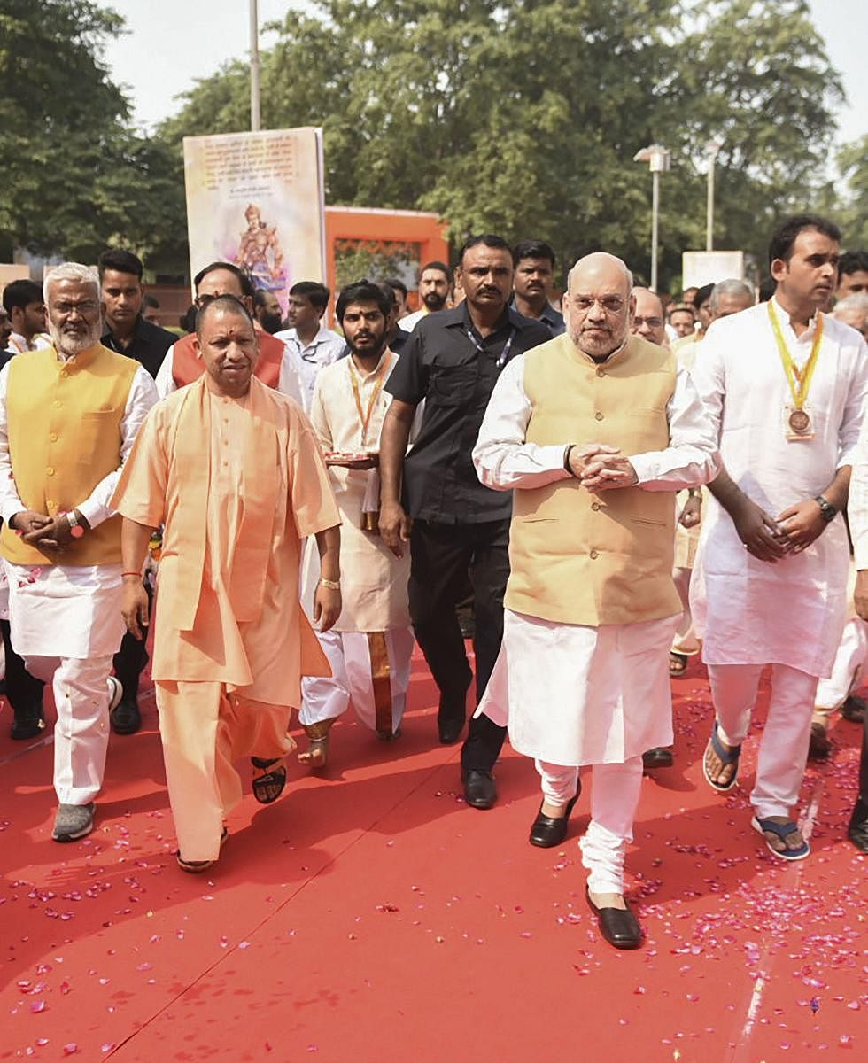 Home Minister Amit Shah and Uttar Pradesh Chief Minister Yogi Adityanath arrive at Banaras Hindu University, in Varanasi on Thursday. (PTI Photo)