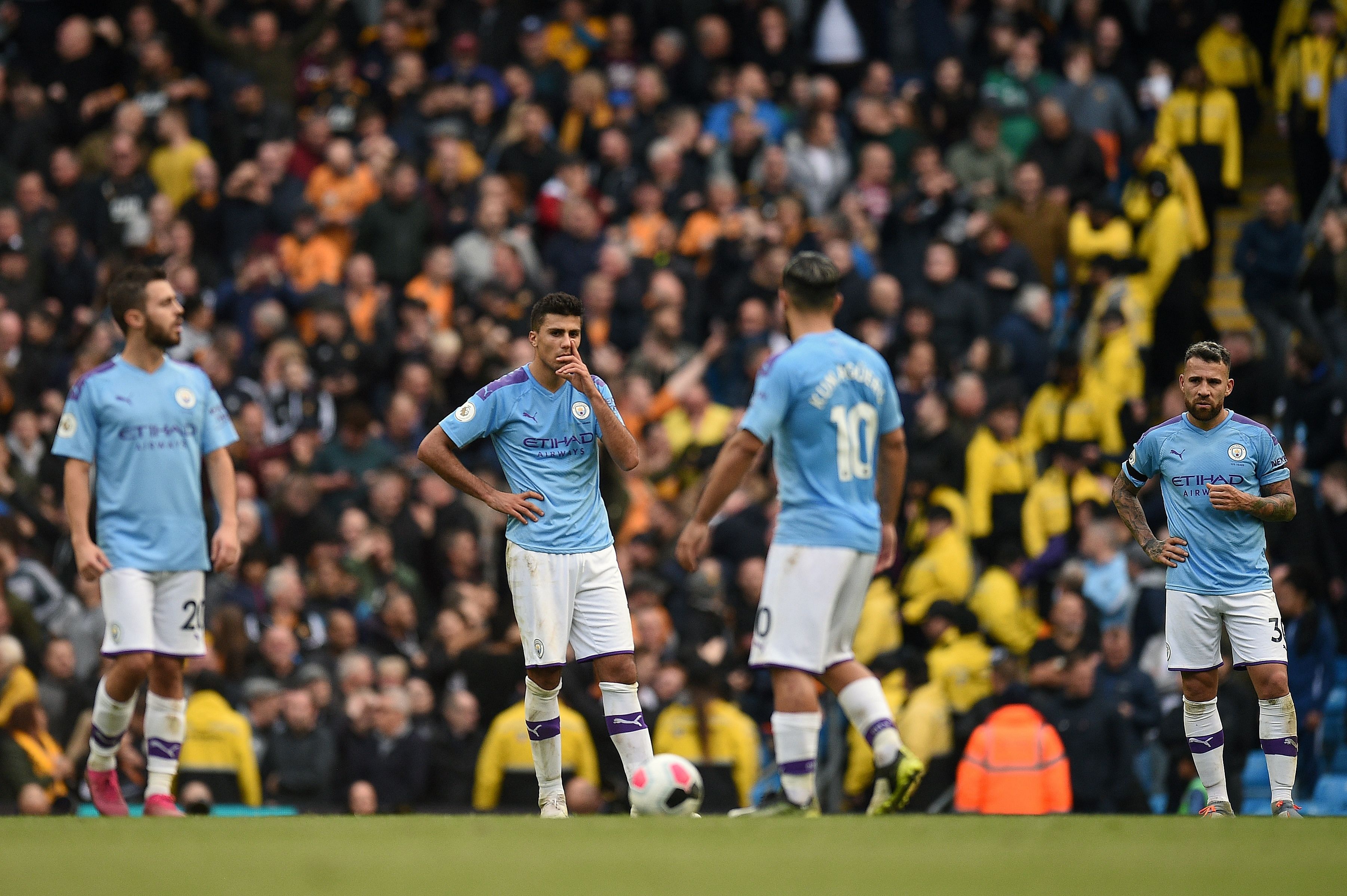 Manchester City players react after conceding their second goal during the English Premier League football match. (AFP Photo)