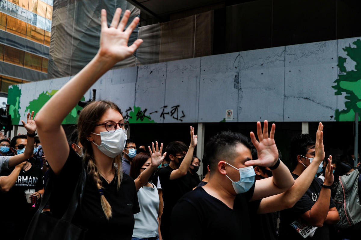 People march to protest against what they say is the abuse of pro-democracy protesters by Hong Kong police, in Central district, Hong Kong, China October 18, 2019. REUTERS/Ammar Awad