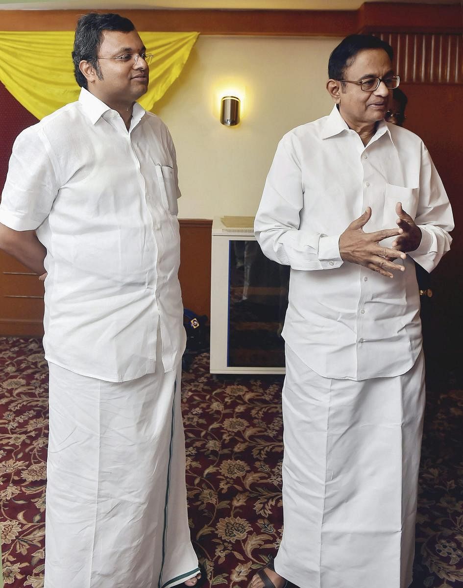 Former finance minister P Chidambaram with his son Karti P Chidambaram (PTI Photo)