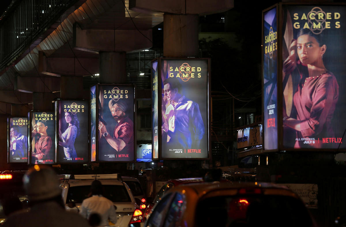 Traffic moves on a road past hoardings of Netflix's new television series "Sacred Games" in Mumbai. (Photo by Reuters)