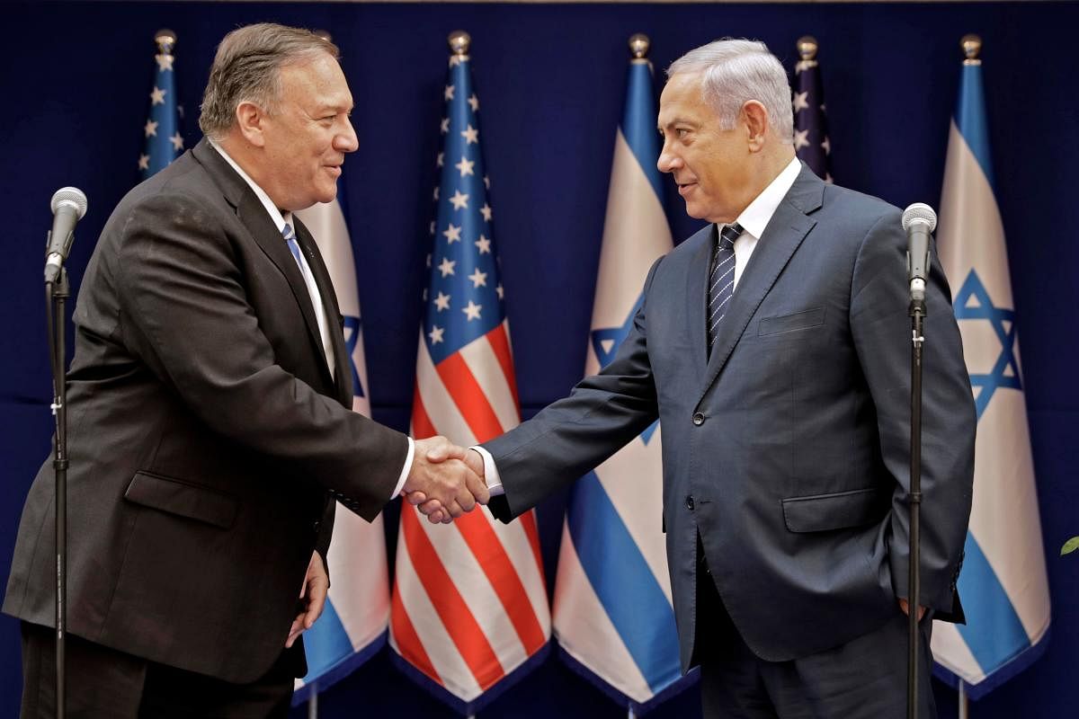 Israeli Prime Minister Benjamin Netanyahu (R) shakes the hand of US Secretary of State Mike Pompeo following their meeting in Jerusalem on October 18, 2019. AFP