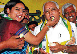 celebration:Actress Shruthi offers a piece of cake to KJP president B S Yeddyurappa, who celebrated his birthday in Bangalore on Wednesday. dh photo