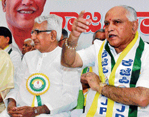 Cusp of change: KJP leaders C M Udasi and B S Yeddyurappa at the party's State executive committee meeting in  Bangalore on Monday. dh photo