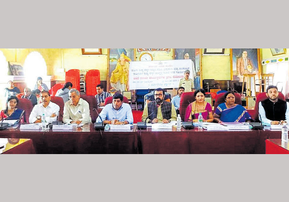 Women and Child Development Committee chairman N A Haris speaks at a meeting in Madikeri on Thursday. DH photo