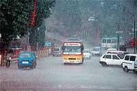 Heavy rains lashing Madikeri on Sunday. DH Photo