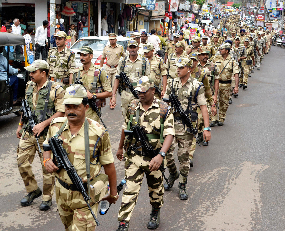 CISF with other security forces personnel conduct a march in city area ahead of Maharashtra Assembly elections, in Karad, Maharashtra, Saturday, Oct. 19, 2019. (PTI Photo)