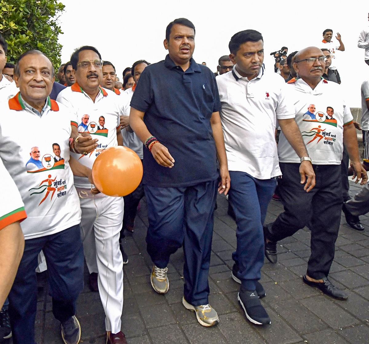 Maharashtra Chief Minister Devendra Fadnavis, Goa CM Pramod Sawant and other BJP leaders at the 'Mumbai Chalali BJP Sobat (Mumbai walks with BJP)' event in Mumbai, Sunday, Oct. 13, 2019. (PTI Photo) 