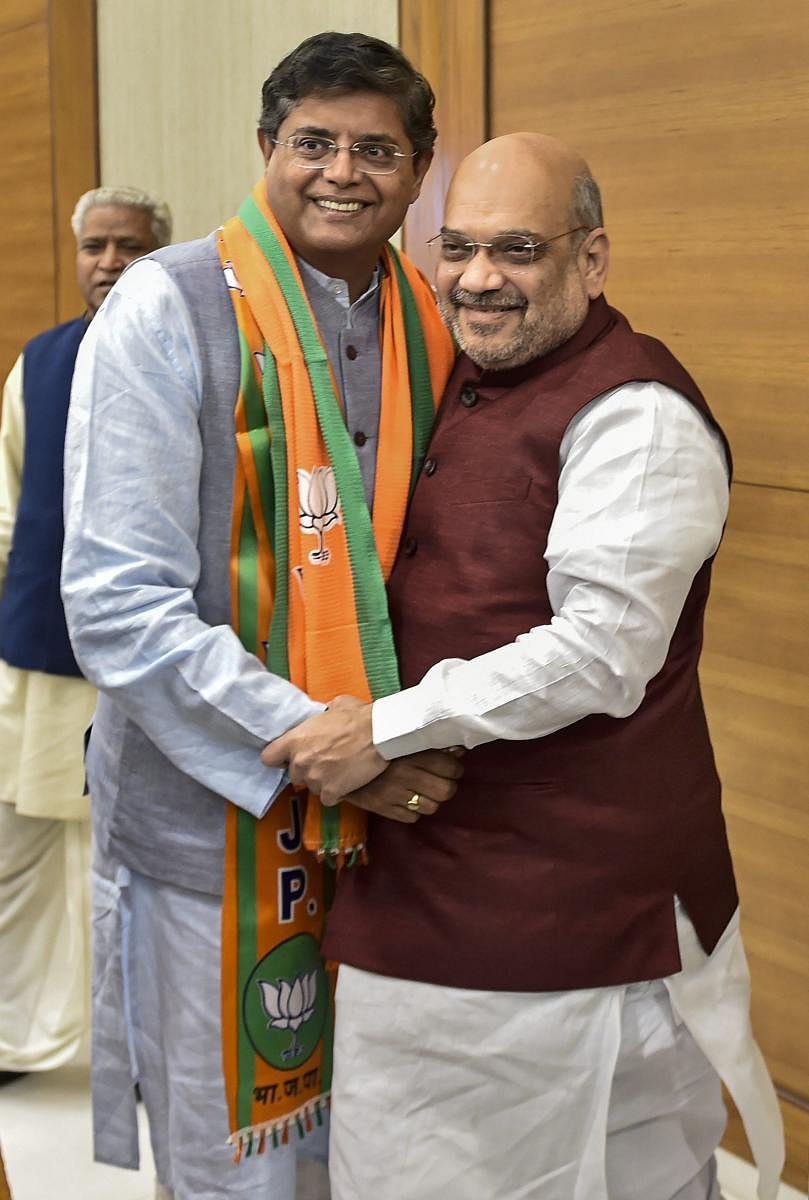 Former Biju Janata Dal MP Baijayant Jay Panda greets BJP national president Amit Shah after joining Bharatiya Janata Party. PTI file photo.