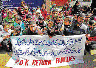 Families of ex-militants who returned from Pakistan-occupied Kashmir during a protest demanding their immediate rehabilitation in Srinagar on Tuesday. PTI  photo