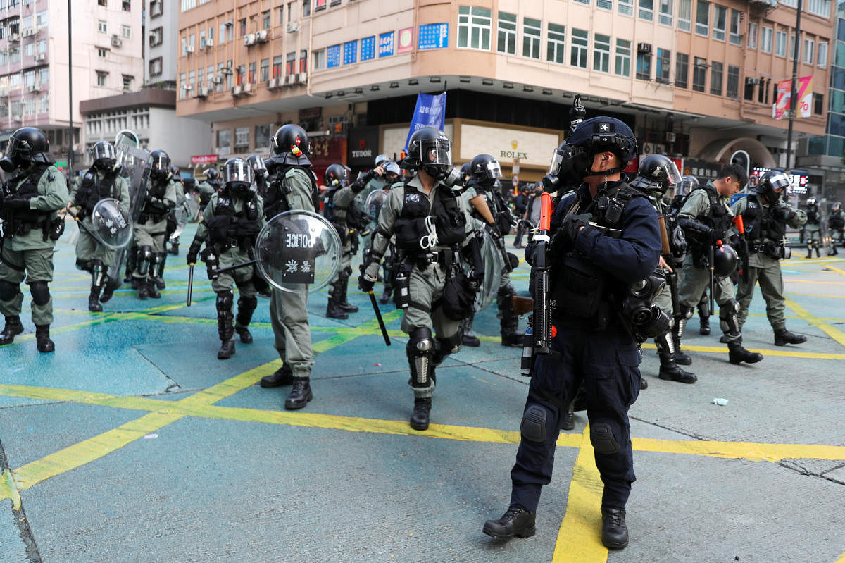 Riot police officers block the street during an anti-government protest in Hong Kong, China, October 20, 2019. REUTERS/Ammar Awad