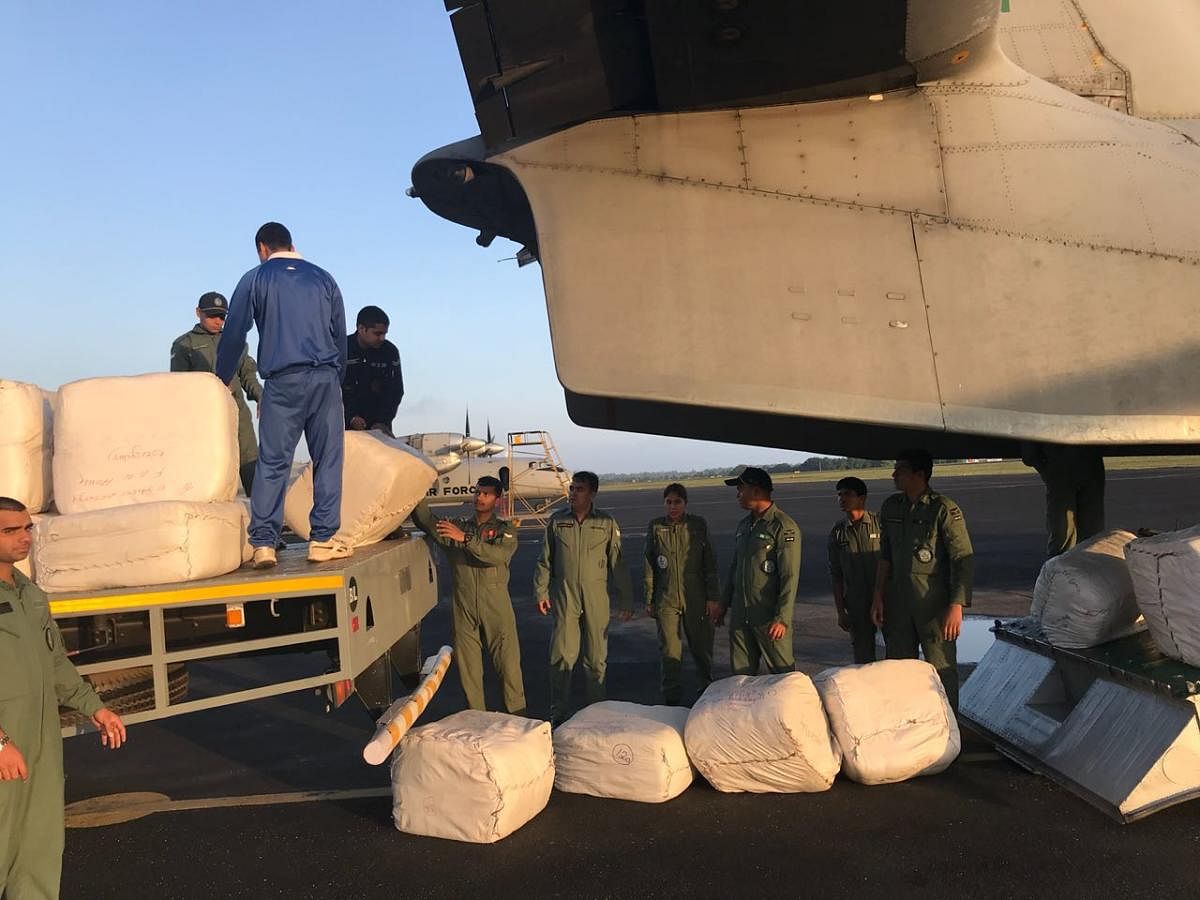 Relief material being loaded onto an IAF aircraft bound for rain-ravaged Kodagu on Wednesday. DH photo.