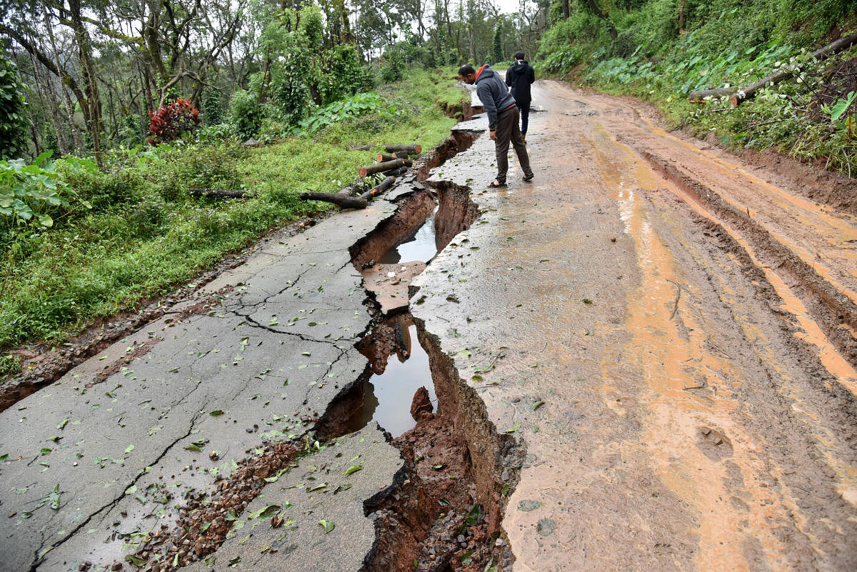 A view of damaged road near Madikeri. Over 5,500 houses have been destroyed and 2,000 km of roads damaged due to the rains in Kodagu and adjoining areas, as per initial estimates. DH PHOTO