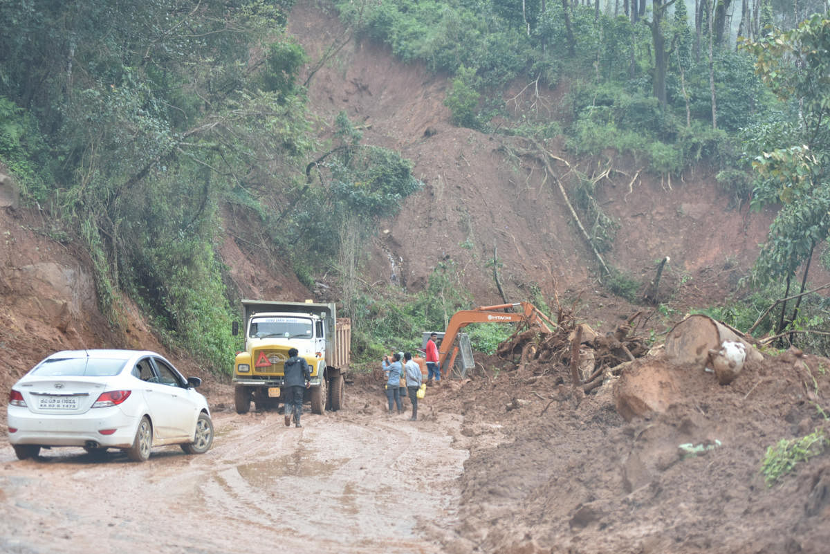 Reconstruction work of a road at Thalathamane in Madikeri in full swing on Friday. DH Photo / B H Shivakumar
