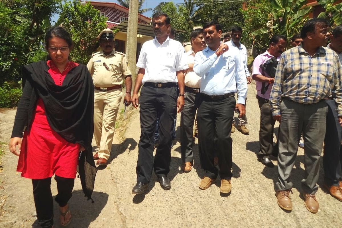 Kodagu DC and DRO P I Sreevidya visits a polling booth in Virajpet on Sunday.