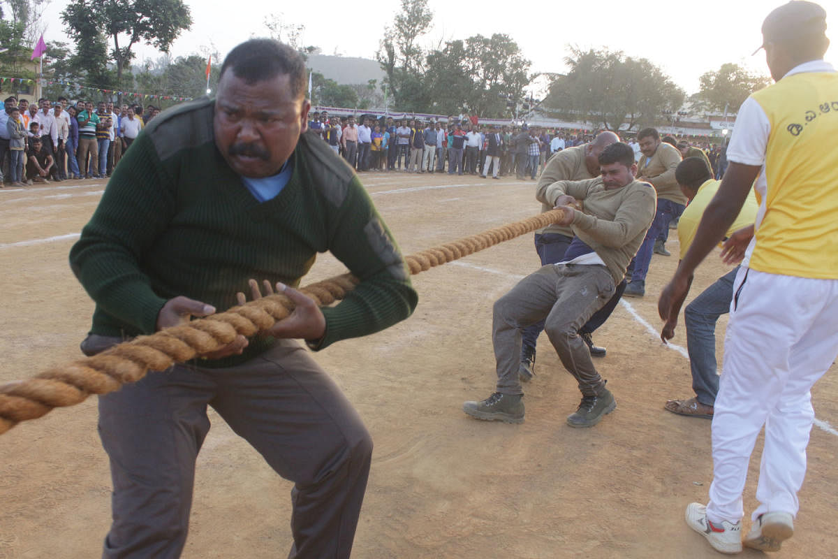 Police personnel take part in a round of tug of war in Madikeri on Saturday.