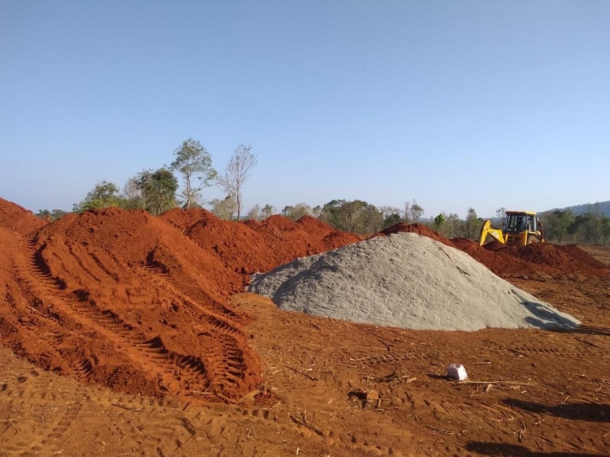 Piles of delay: One of the largest sites allocated for construction of new houses at Jambooru. The land, spread across 50 acres, is being levelled but construction work is yet to commence.DH Photo/Ambarish B