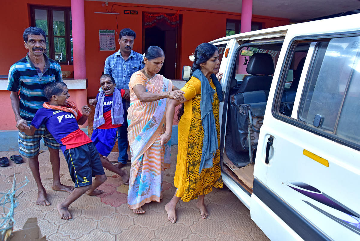 Rajeevi (in sari), with her three endosulfan-affected children, in Puttur taluk, Karnataka. Credit: DH Photo by Govindaraj Javali
